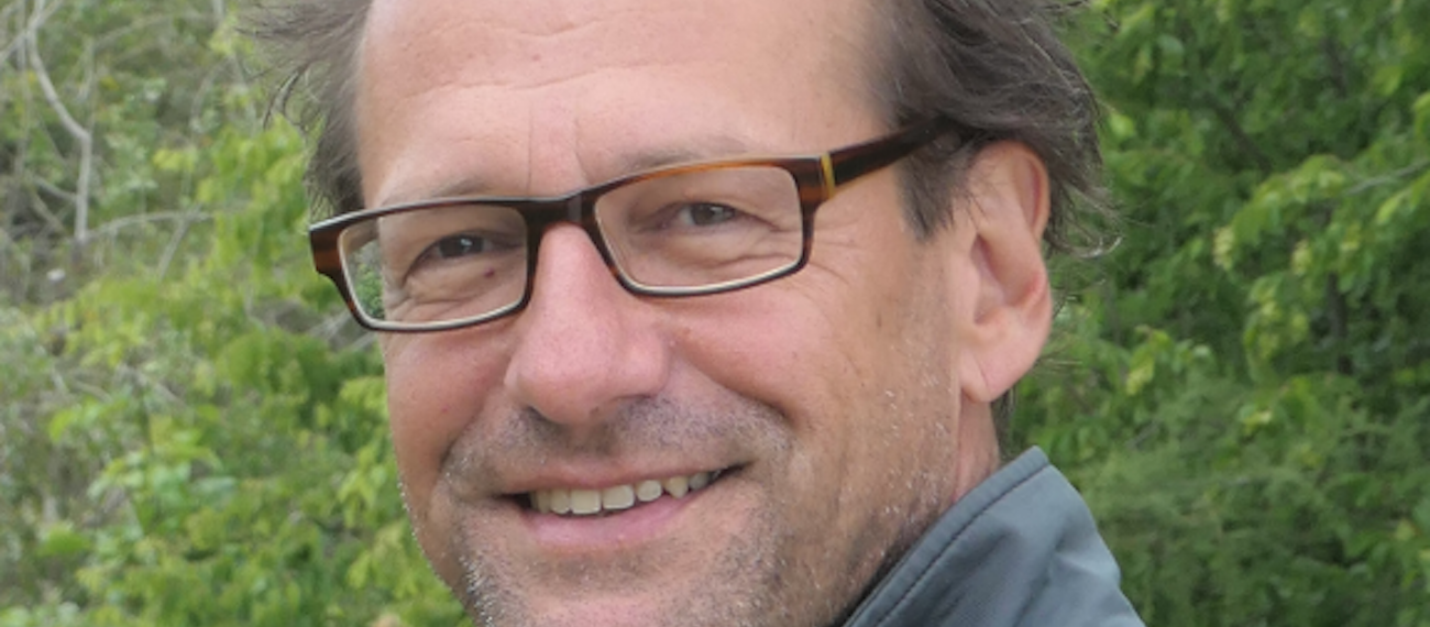 a man with glasses part of the face visible